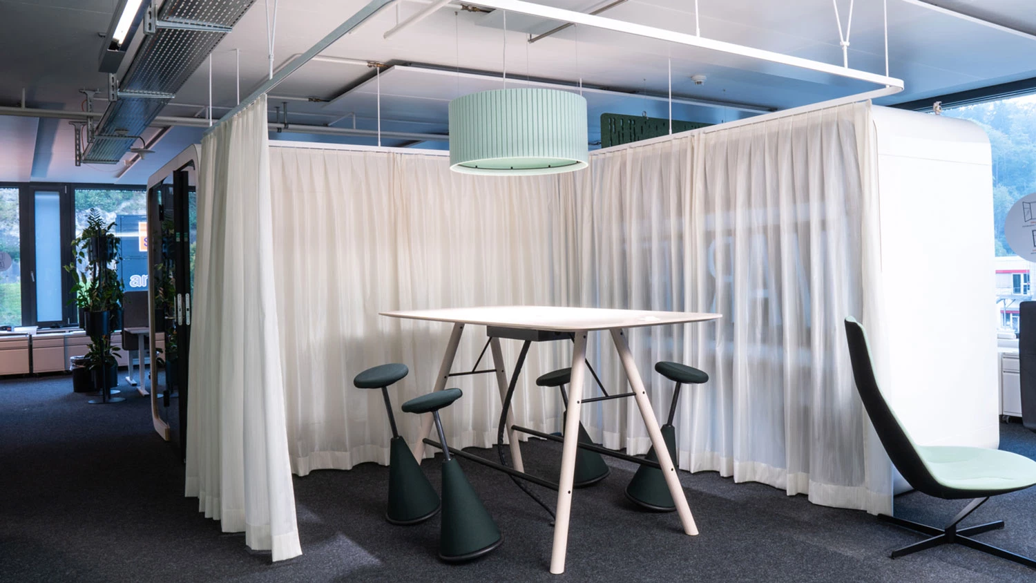 Round blue acoustic pendant light for a quiet environment.