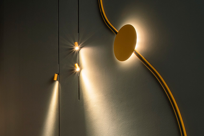 Minimal Track in gold with various inserts such as spots and indirect surface washlights.