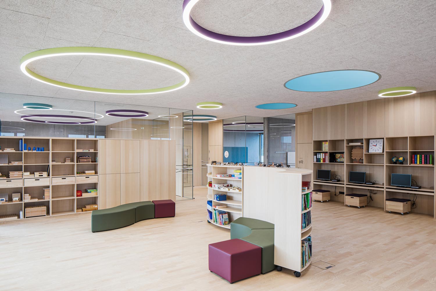 Colourful LED lighting for dynamic lighting design in the computer and games room of a primary school